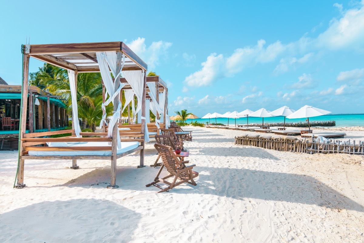 cabanas on a white sand beach