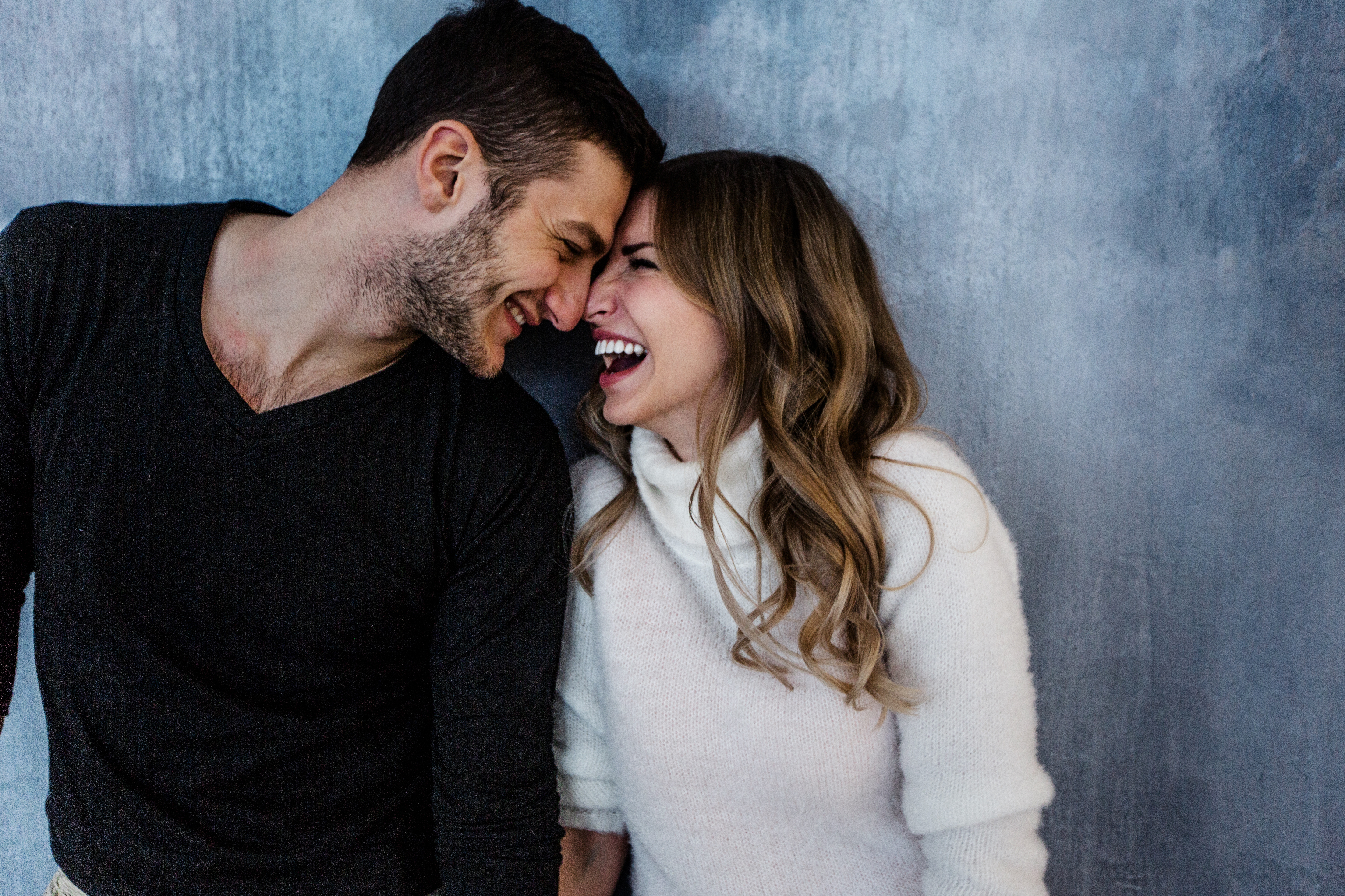 man and woman laughing together, what he wants you to say