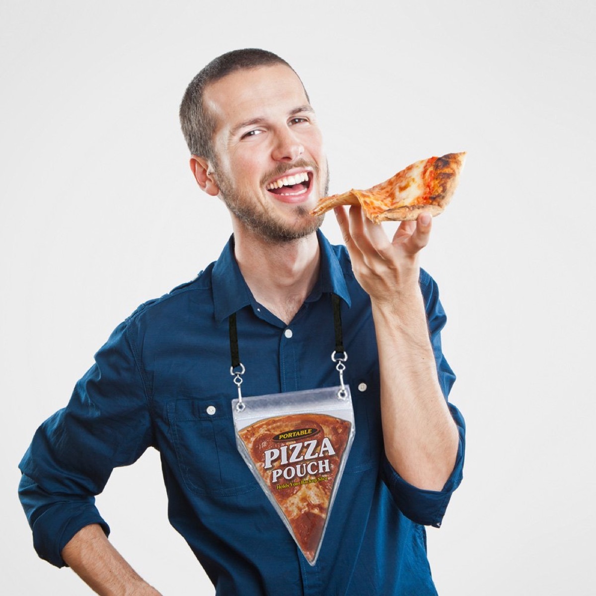 young white man holding pizza