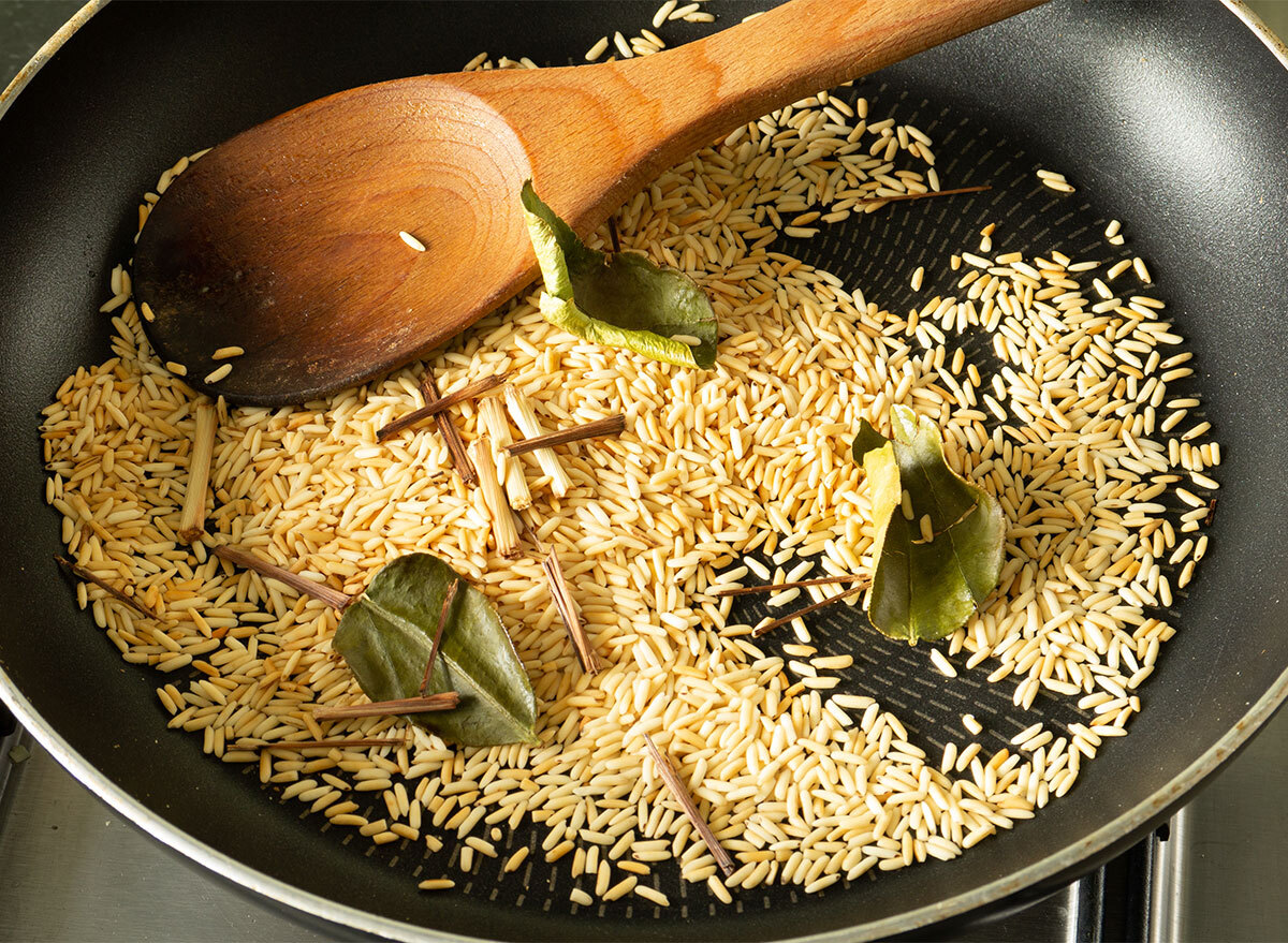 toasting rice in a pan