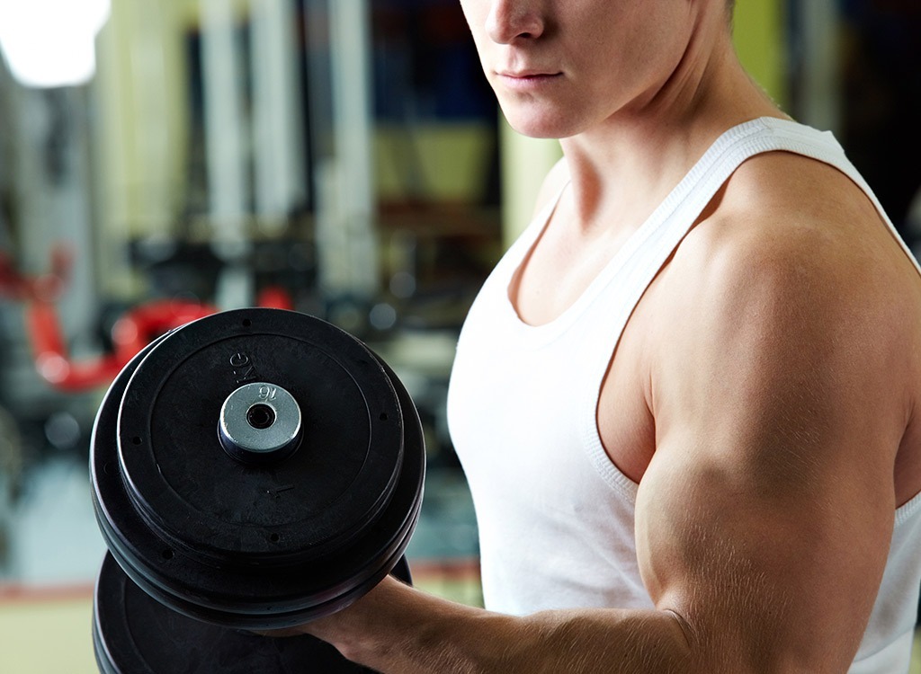 man lifting weights