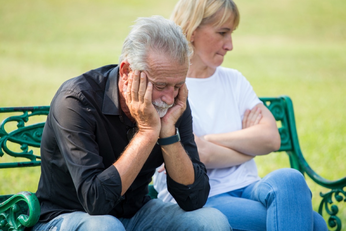 older couple fighting on a park bench, things you should never say to your spouse