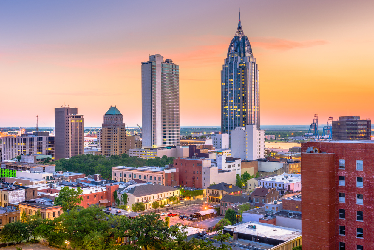 The skyline of Mobile, Alabama at dusk