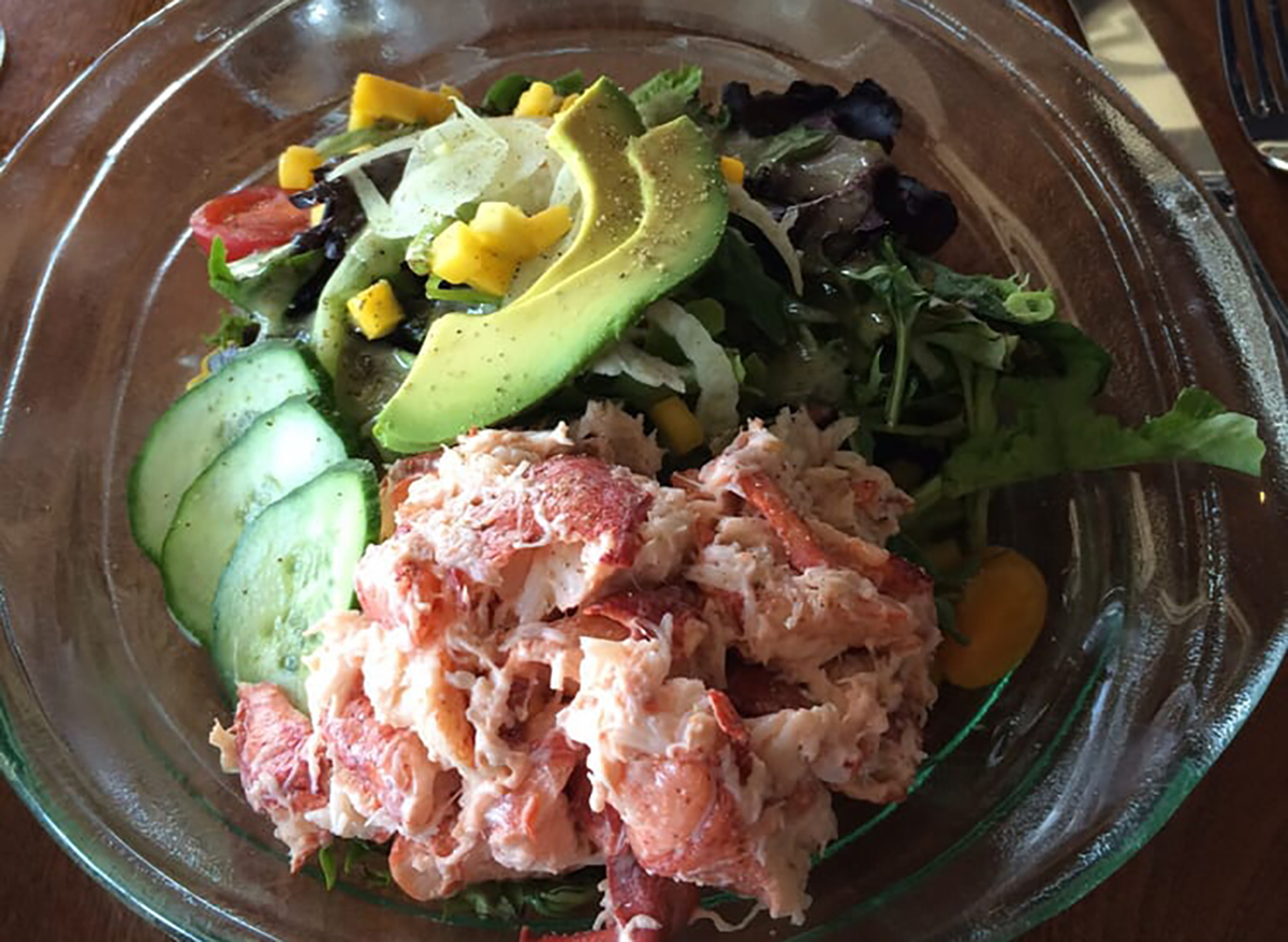 lobster salad in bowl with avocado slices