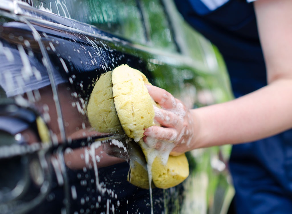 Woman washing car