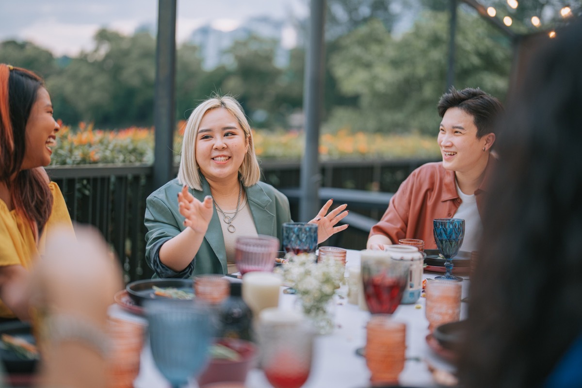 Friends enjoying Outdoor Dining Social Gathering