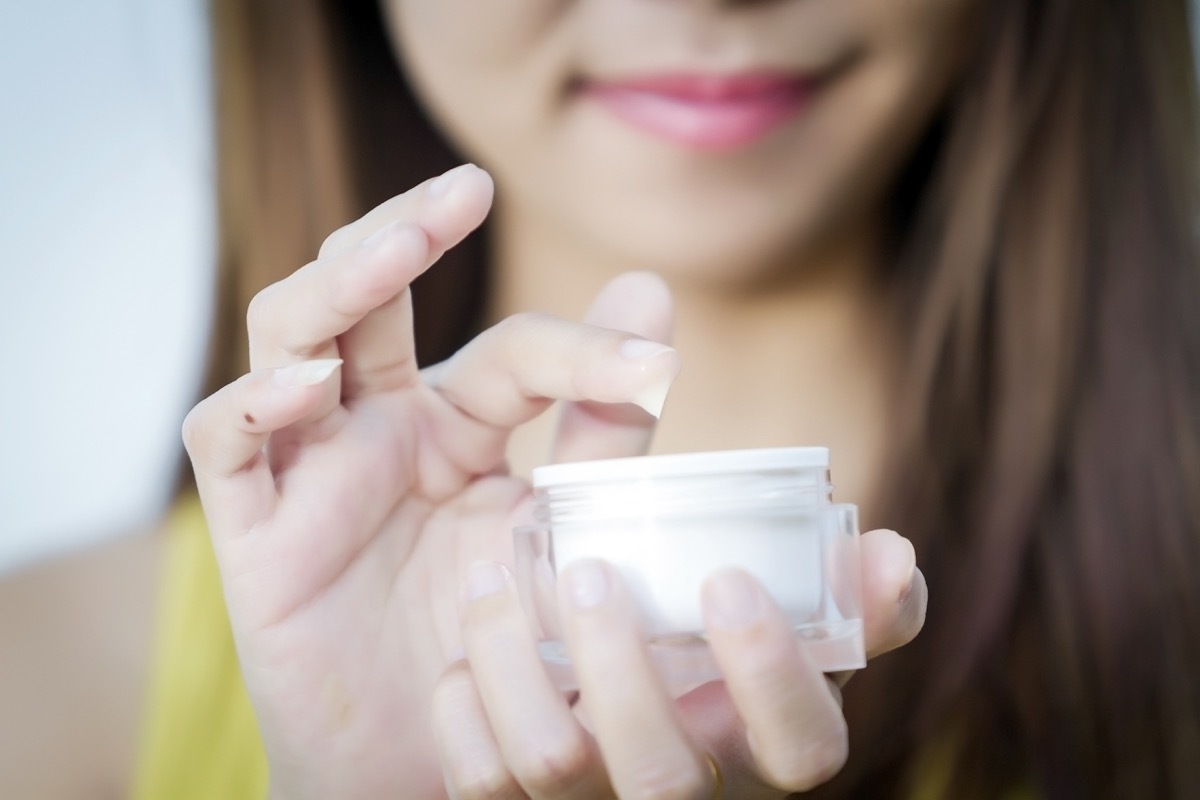 Moisturizing cream in female hands