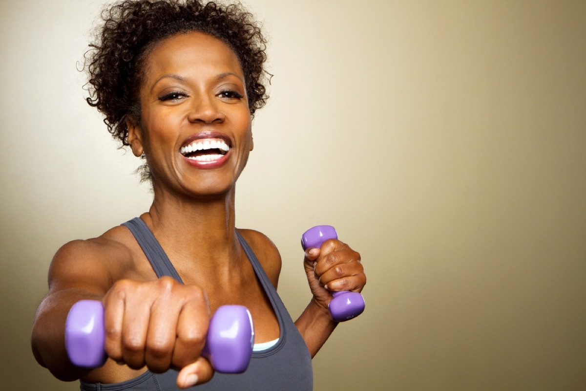 happy older woman working out with dumbbells, things you shouldn't say about someone's body