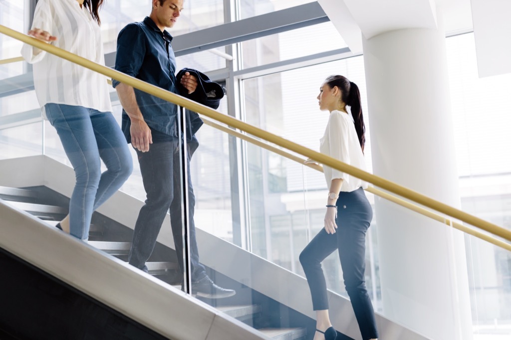 office workers taking the stairs Signs Your Boss Wants to Fire You