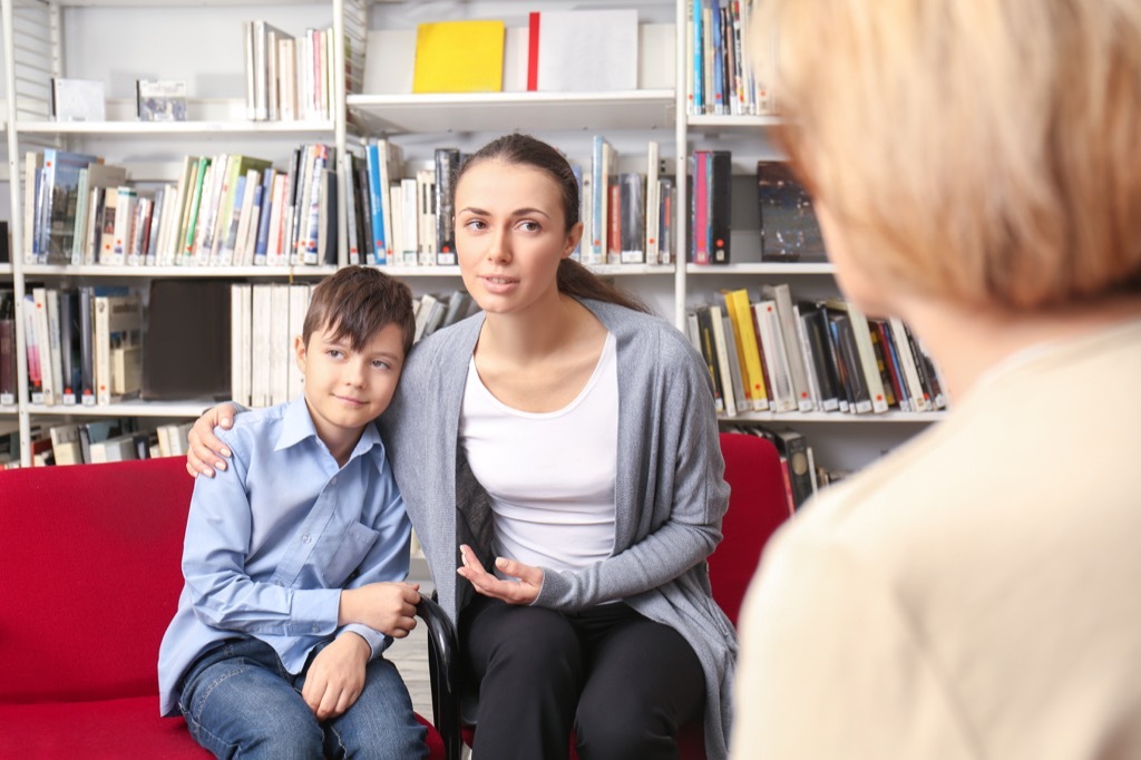 mother and son at a parent-teacher conference, things you should never say to a teacher