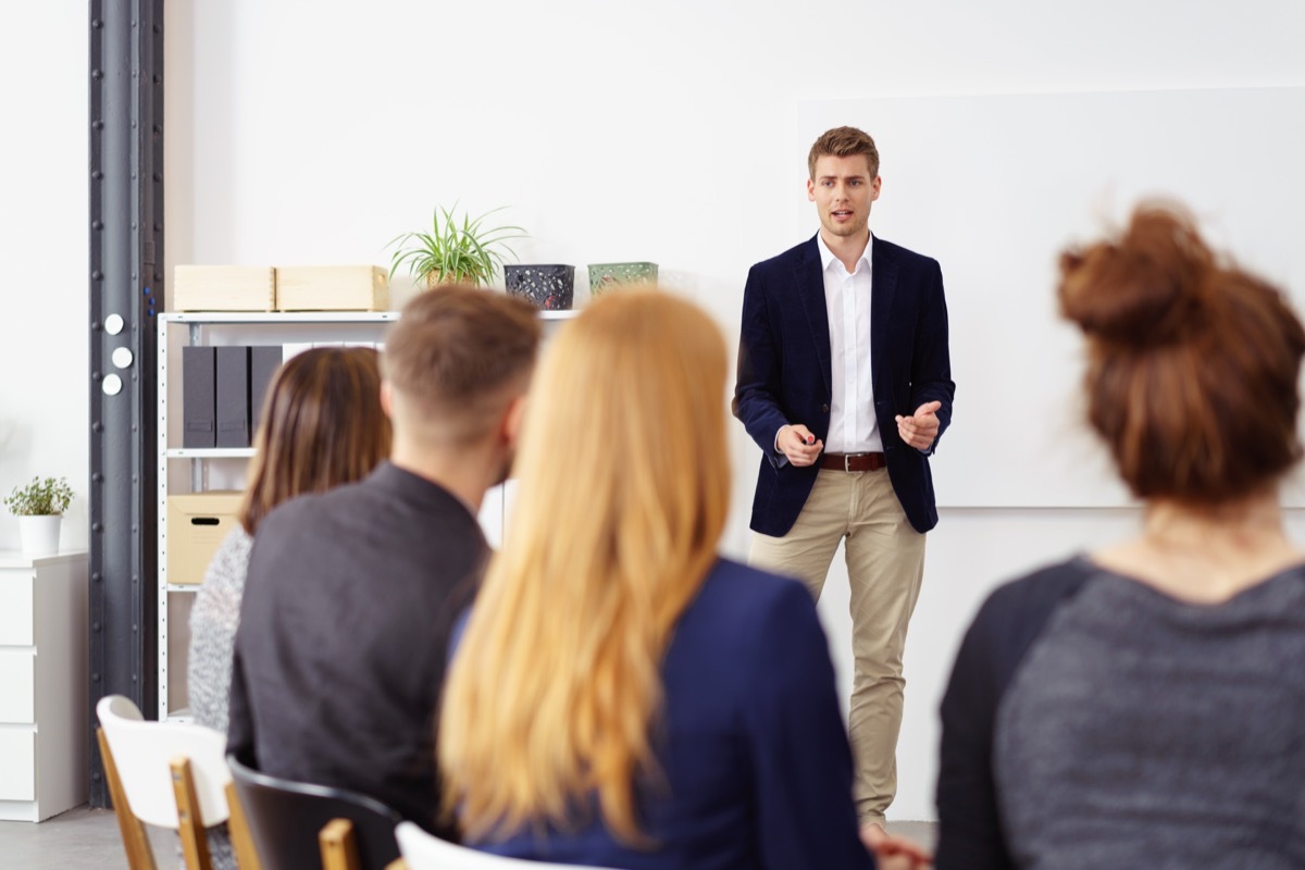 businessman giving a presentation to a group of people