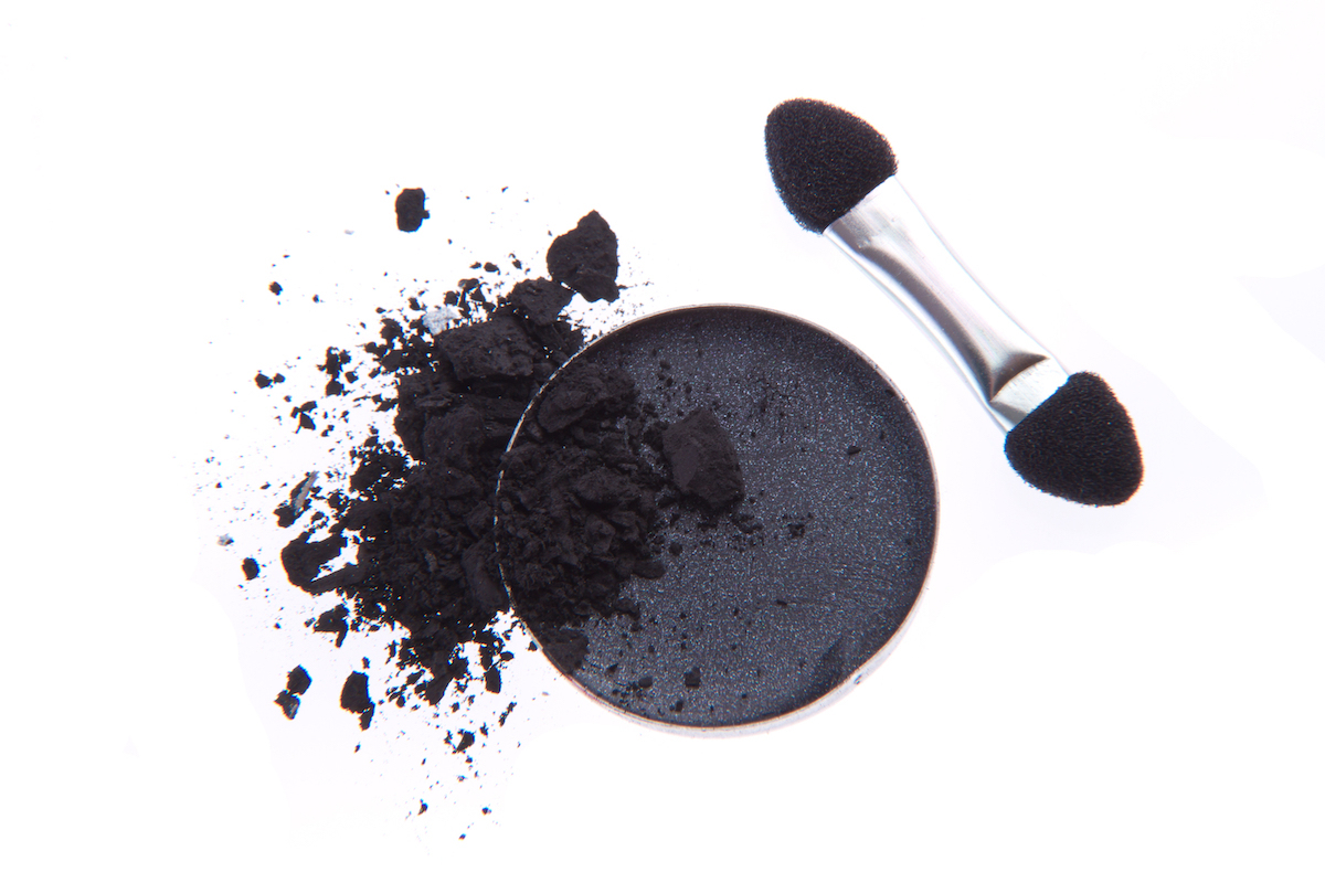 crushed black eyeshadow isolated on white background