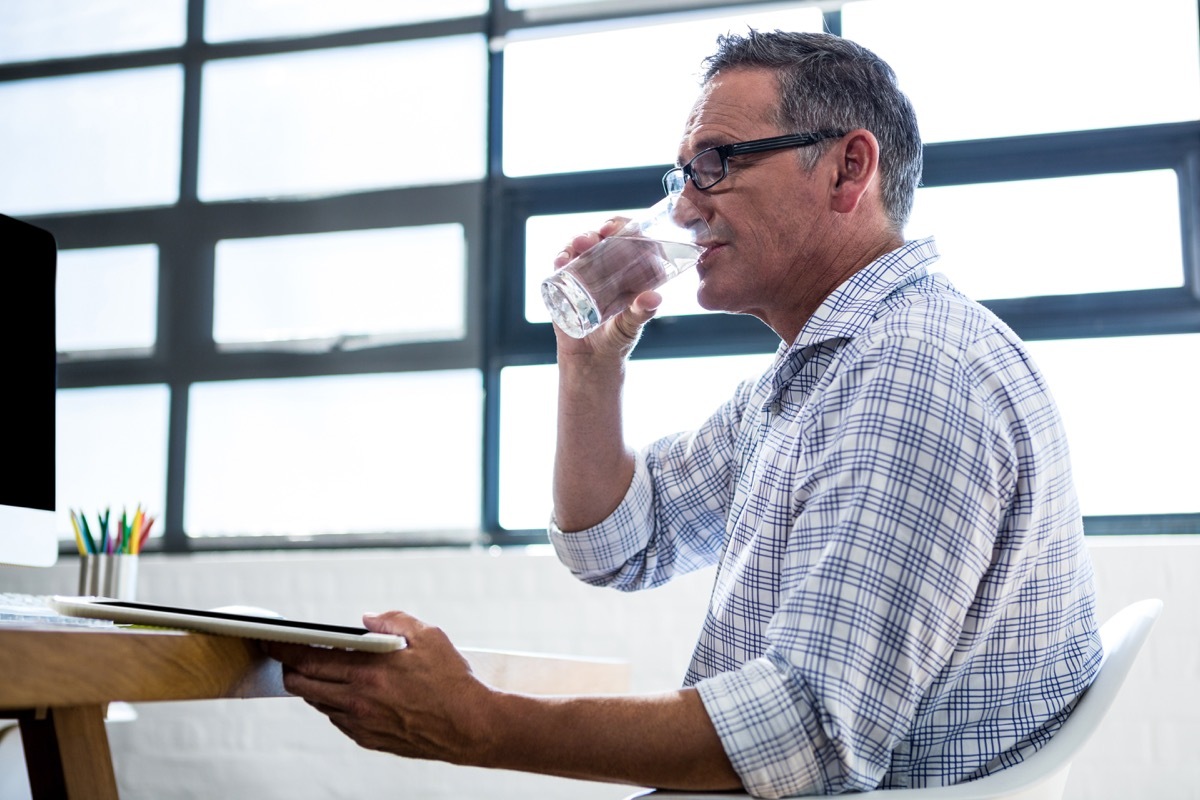 Man drinking glass of water