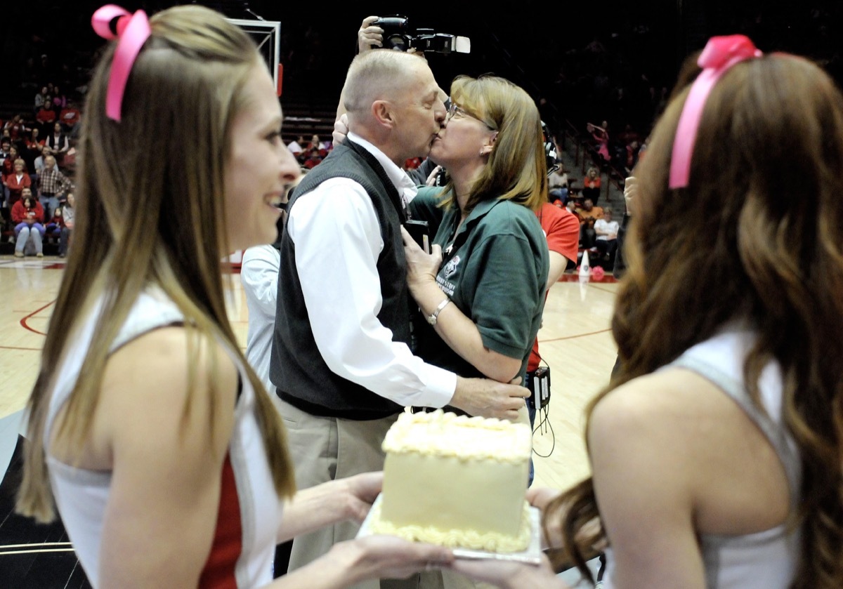 D34X4J Feb. 9, 2013 - Albuquerque, New Mexico, U.S. - 020913.Dan Barkley, a clock operator at The Pit, kisses Kim Fields, an event staff supervisor, after proposing to her on center court during half time between UNM and UNLV's women's basketball teams, Saturday, Feb. 9, 2013, in Albuquerque, N.M. ''I wouldn't have expected it,'' Fields said about the public proposal that surprised Fields. (Credit Image: © Marla Brose/Albuquerque Journal/ZUMAPRESS.com)