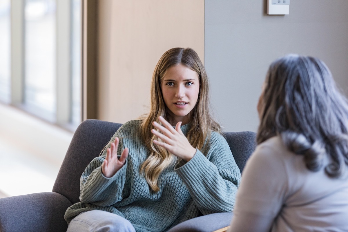 student talks to her mentor redirecting conversation while sitting together