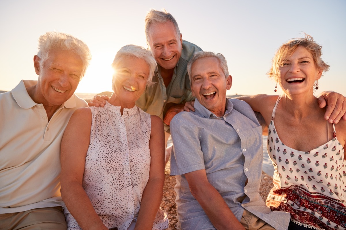 Group of Senior Friends Hanging Out on the Beach