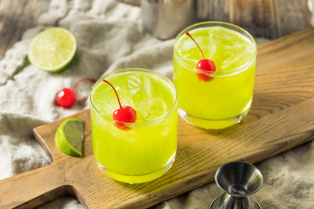 two midori sours with cherries