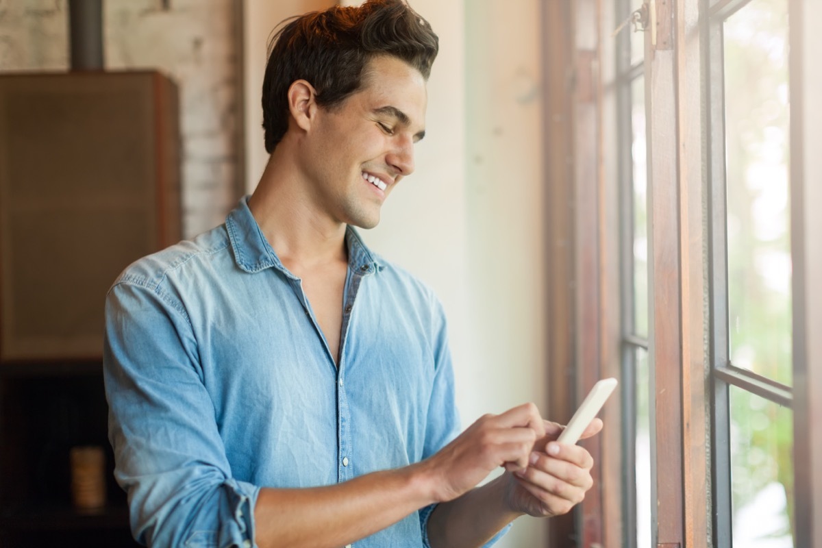 Man texting a friend on his phone