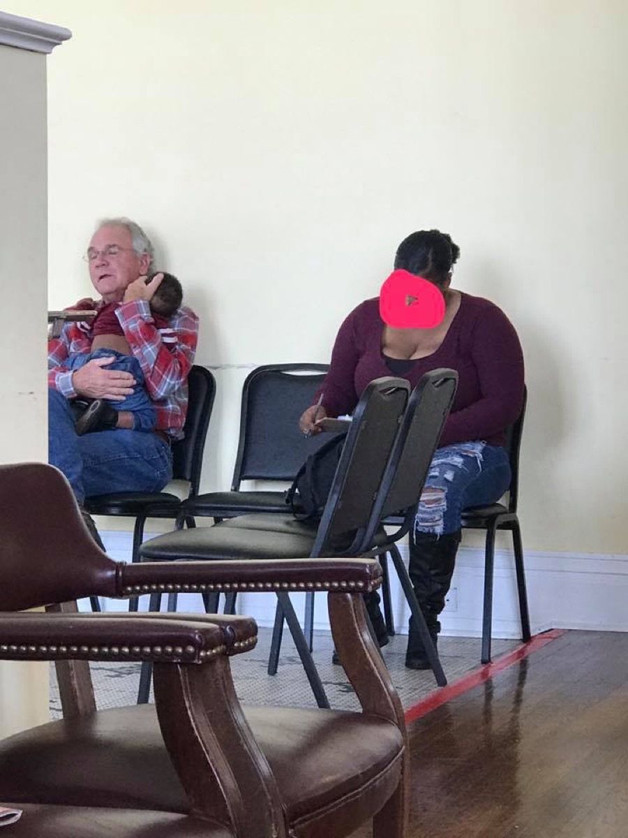 Stranger Comforts Baby Waiting Room