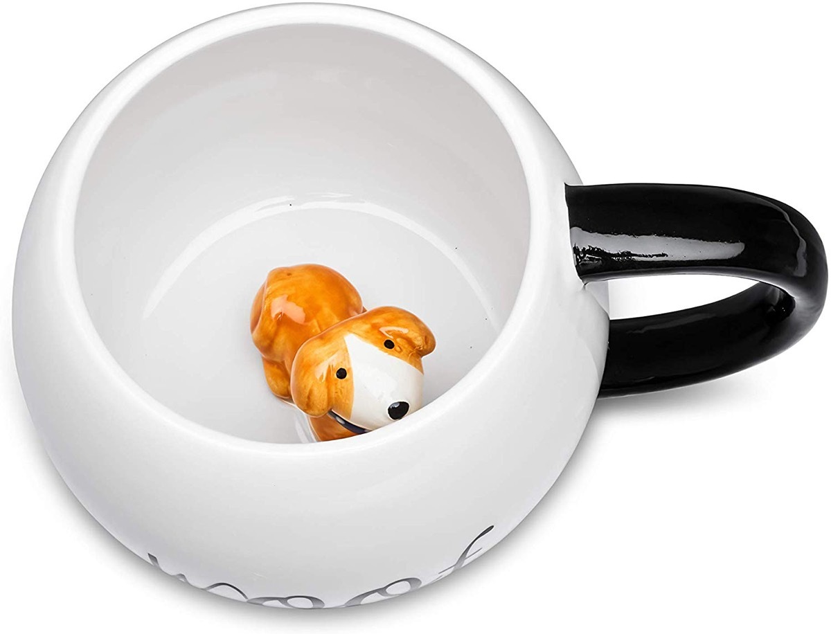 A cute dog mug from Amazon with a fun creature inside