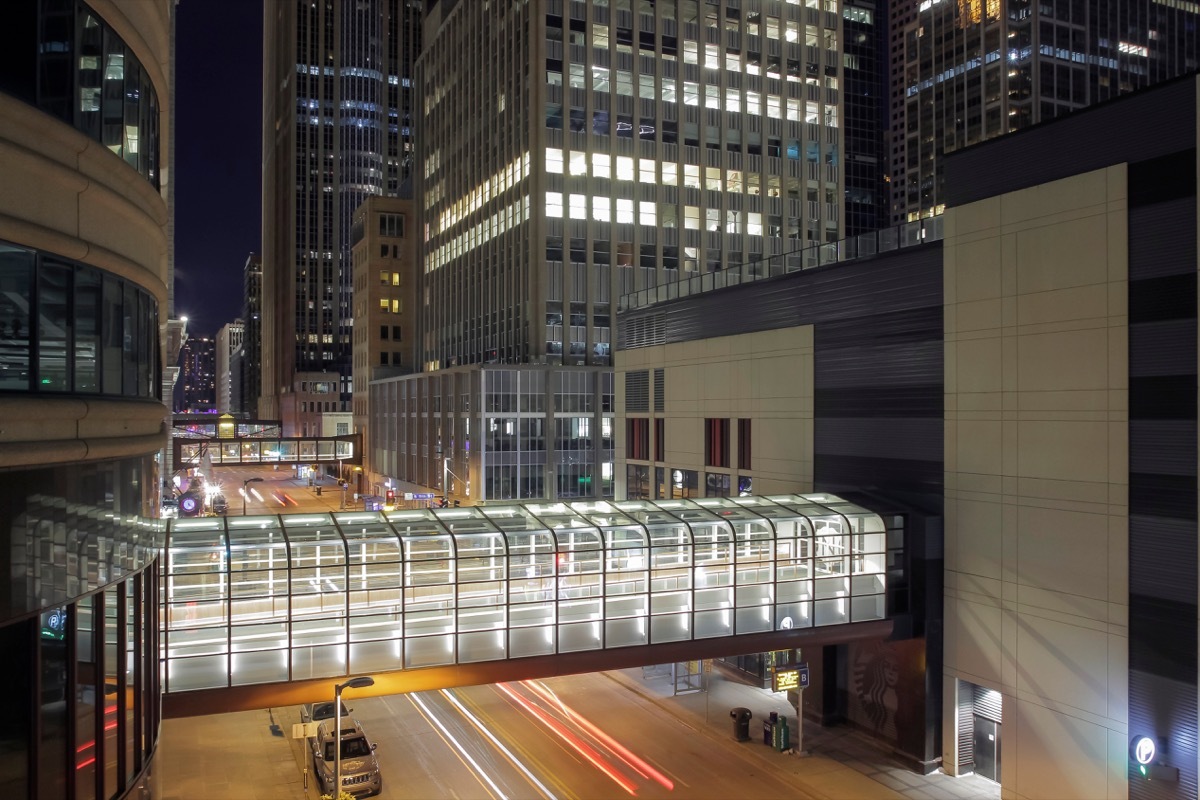 A High Angle Medium Shot on Downtown Minneapolis Skyscrapers and Skyway Walkways over Long Exposure Traffic during a Winter Night