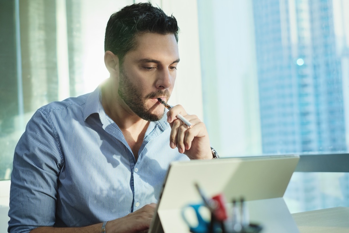 Man smoking electronic cigarette