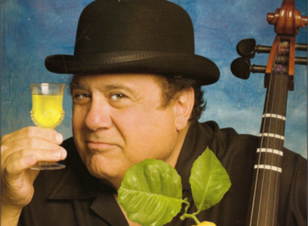 Danny DeVito holding a limoncello