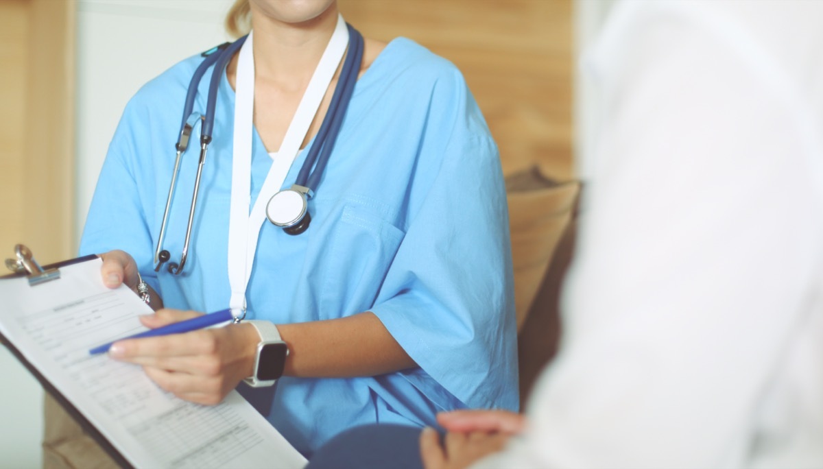 Woman doctor explaining diagnosis to her female patient