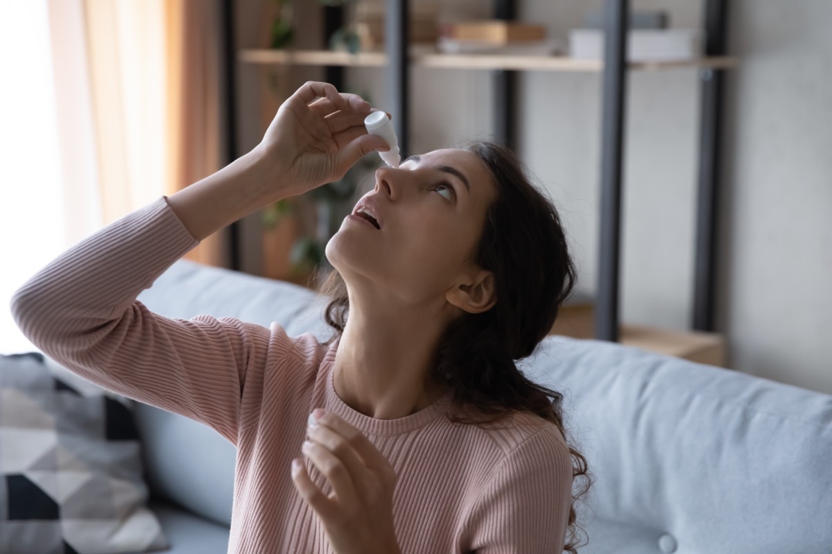 Woman Putting Drops in Her Eyes