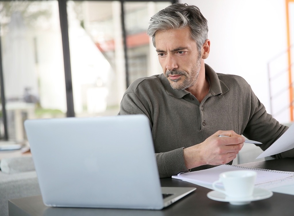 man at computer Smartest Men Get Ahead social media cheating