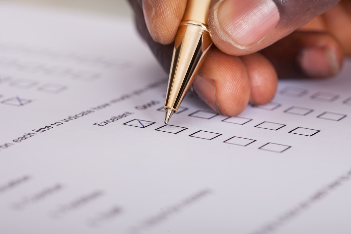 Patient filling out form with his own pen