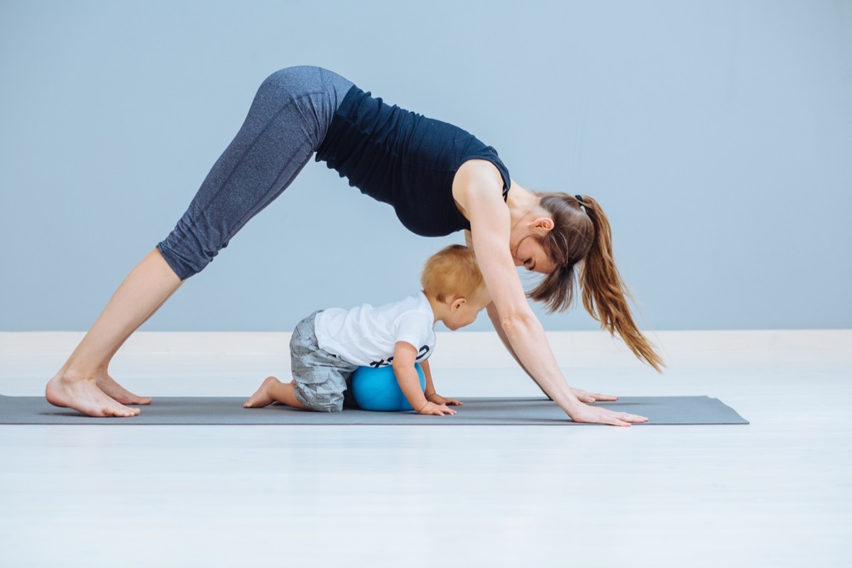 Mom working out at home with her baby