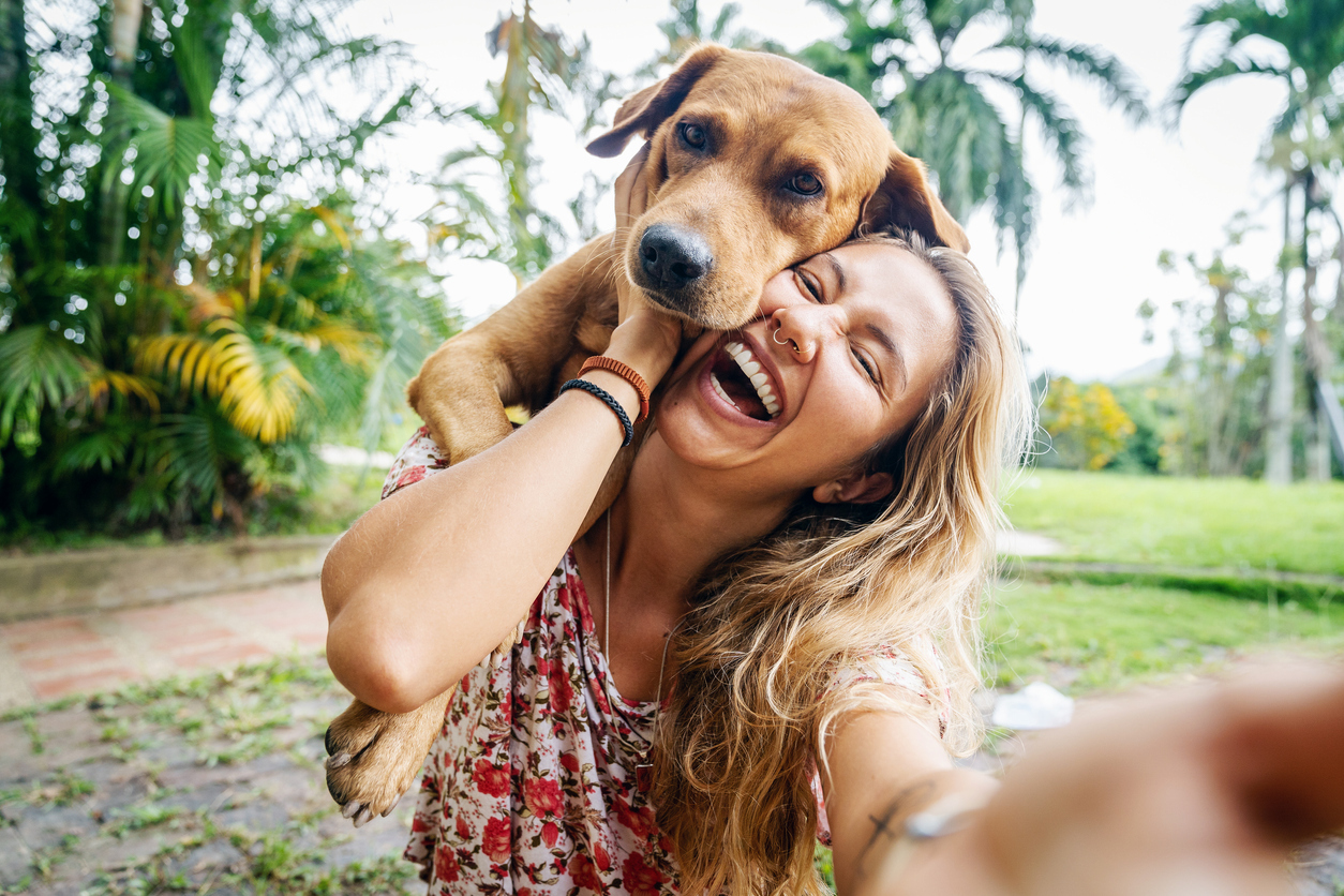 young woman and golden retriever dog