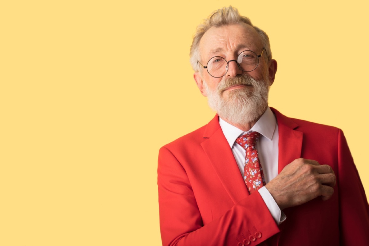 older man wearing red suit, relationship white lies