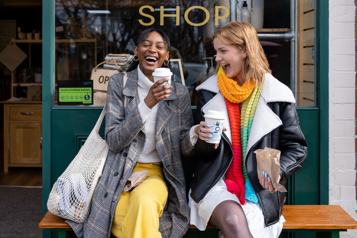 best friends laughing with coffee