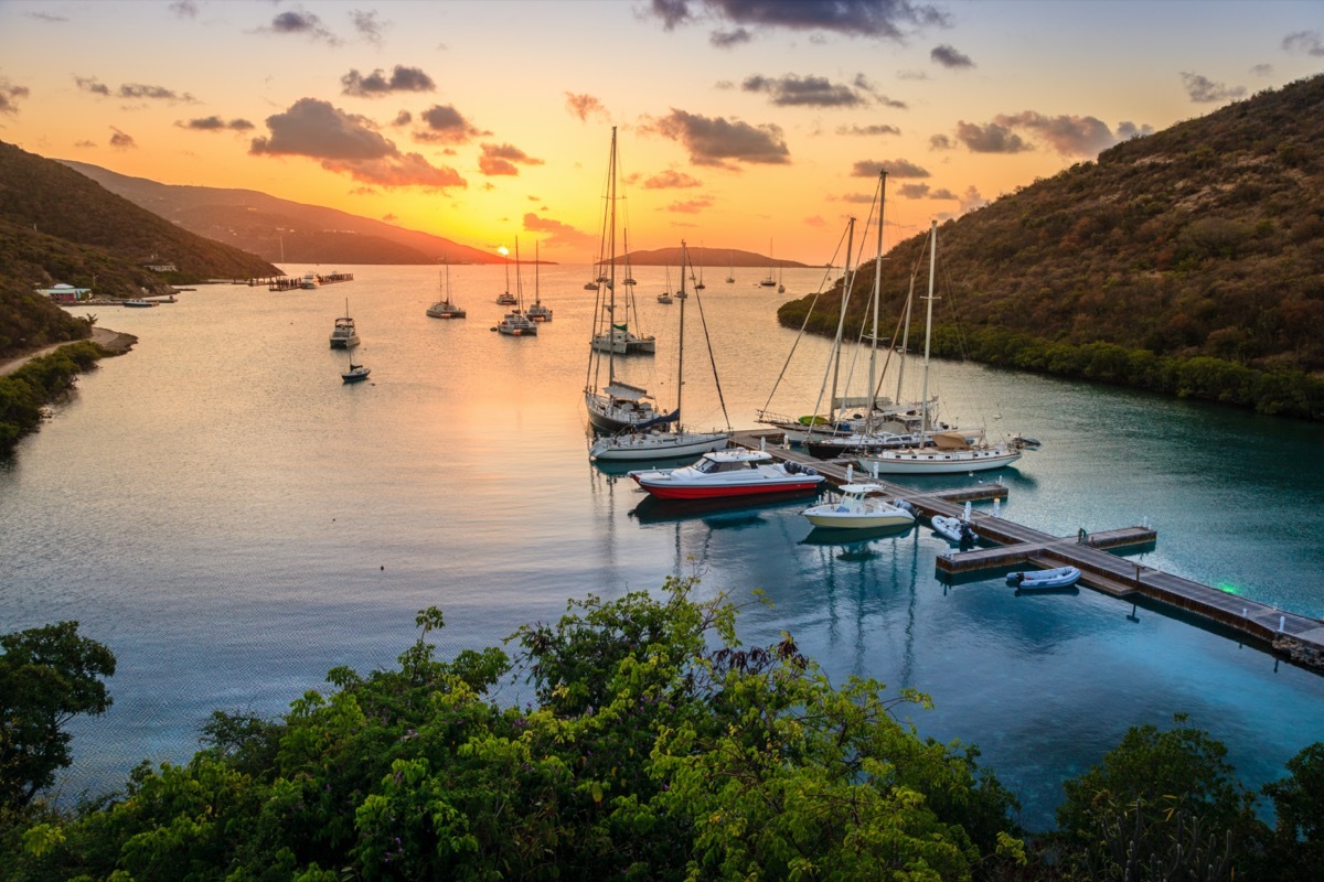 sunset over islands and boats