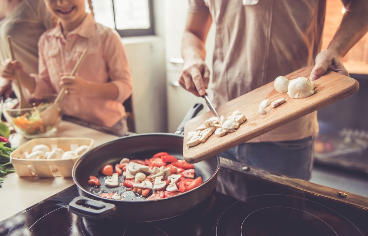 mother and kids cooking healthy dinner