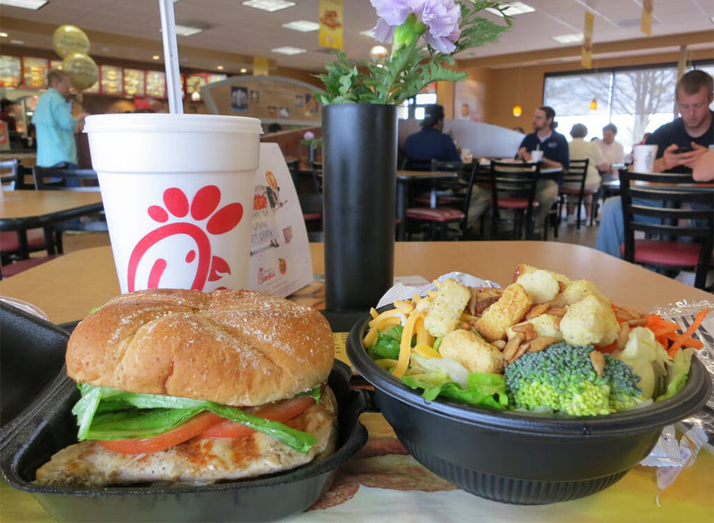 Chick fil a chicken sandwich and salad in restaurant