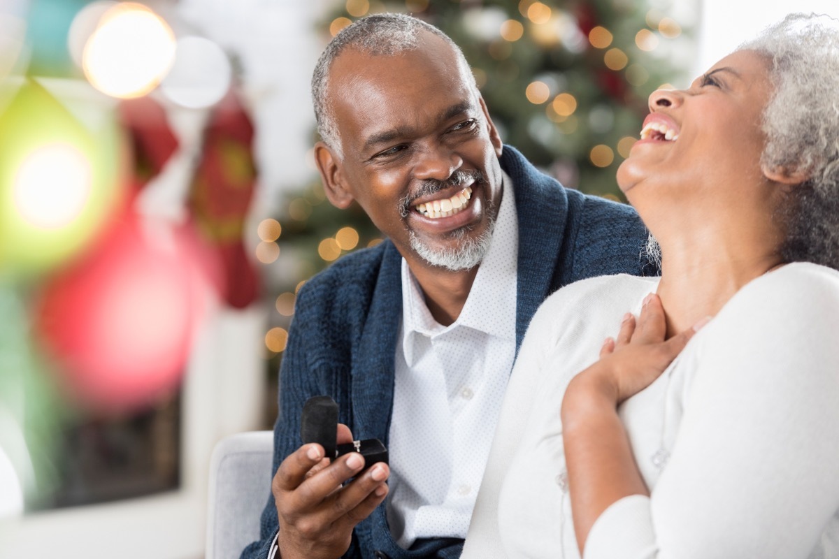 old man giving gift to his wife