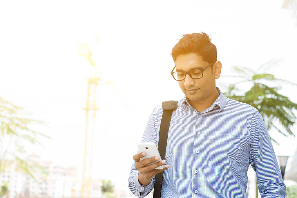 Businessman on Cell Phone Social Media