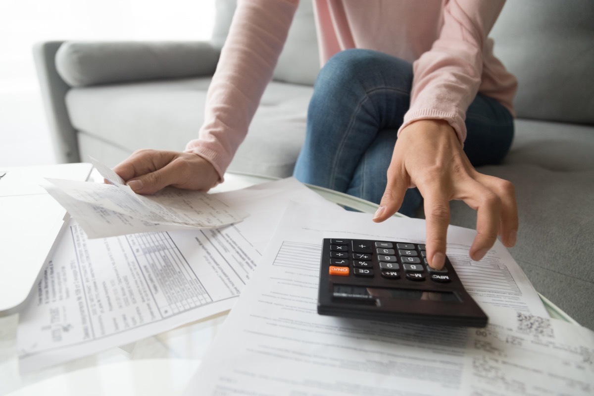 Woman calculating rent payment