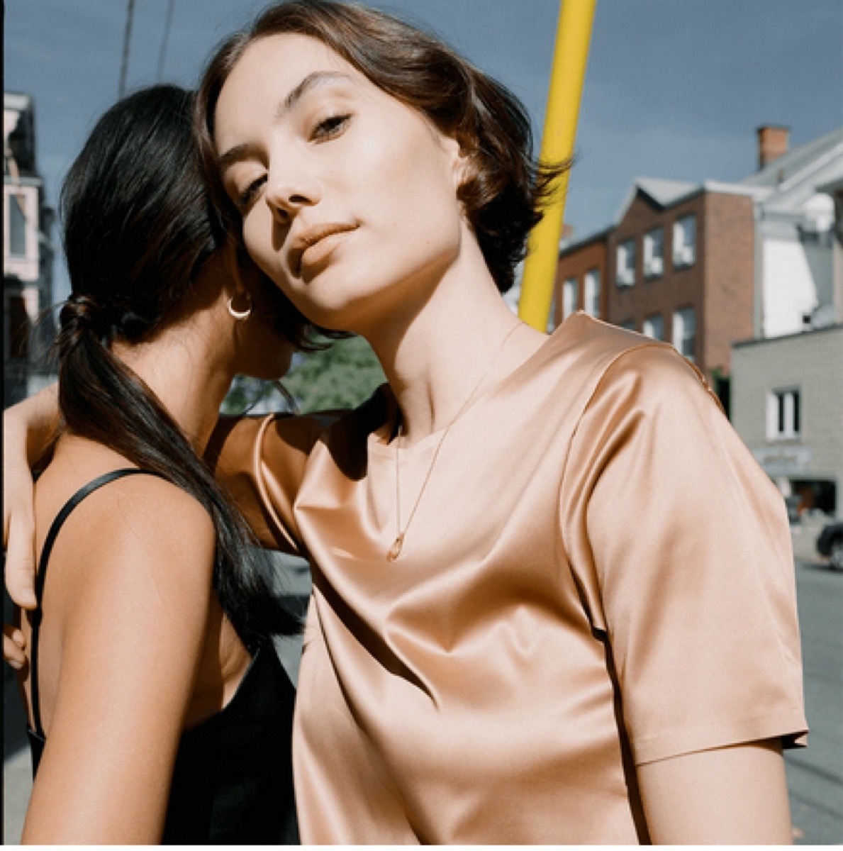 young woman in silk t-shirt