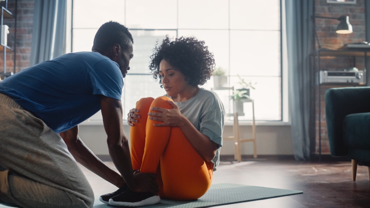 Couple is Doing Sport Exercises at Home.