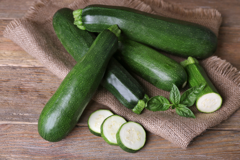 Zucchini sitting on a burlap bag