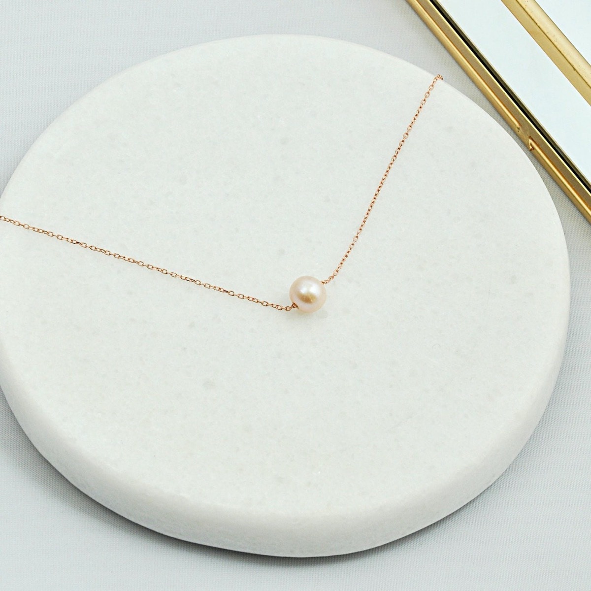 single pearl on a chain