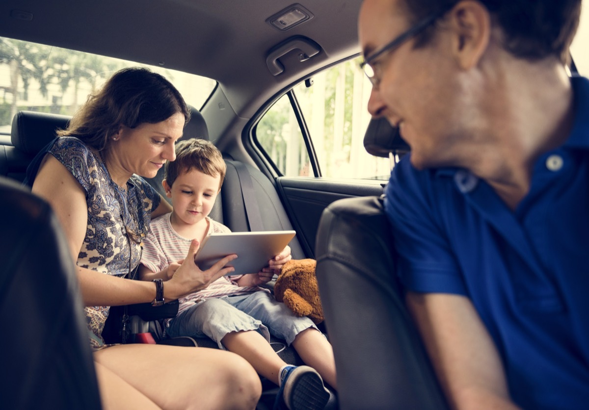 Family playing game in car