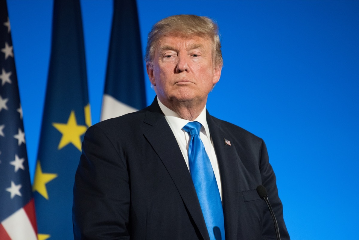 trump staring while standing at podium