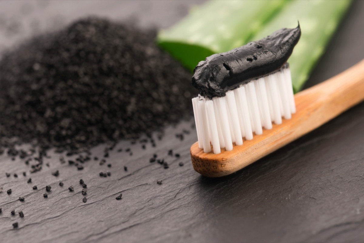 Toothbrush with black charcoal toothpaste with aloe vera