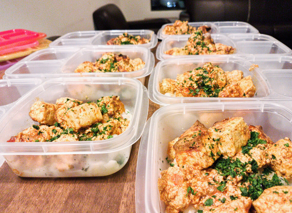 prepped containers of chicken on a table