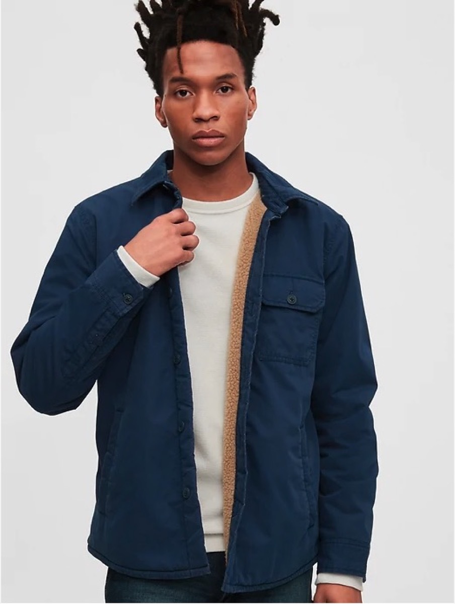 young black man in men's shirt jacket